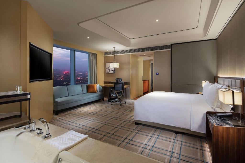 Postel nebo postele na pokoji v ubytování Hilton Fuzhou