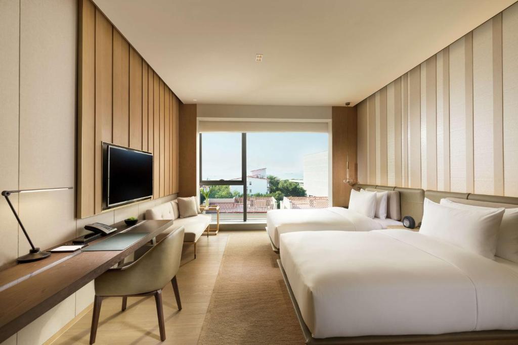 TV a/nebo společenská místnost v ubytování Joyze Hotel Xiamen, Curio Collection By Hilton