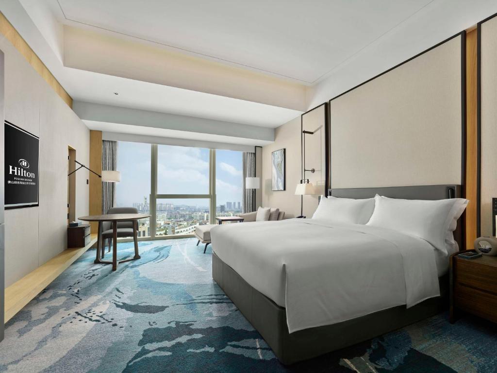 Postel nebo postele na pokoji v ubytování Hilton Foshan Shunde - Free Shuttle Bus to Canton Fair