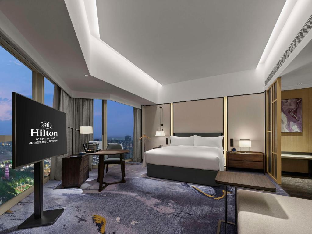 Postel nebo postele na pokoji v ubytování Hilton Foshan Shunde - Free Shuttle Bus to Canton Fair