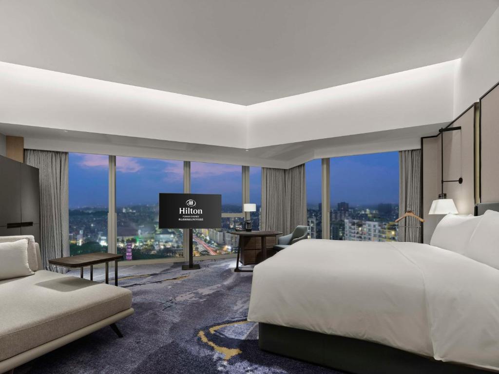 Postel nebo postele na pokoji v ubytování Hilton Foshan Shunde - Free Shuttle Bus to Canton Fair