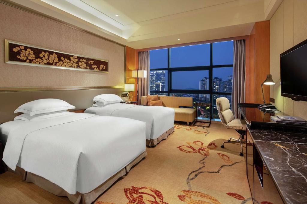 Postel nebo postele na pokoji v ubytování Hilton Guangzhou Baiyun - Free Shuttle for Canton Fair Period, Close to Luhu Golf Club & Leather Market