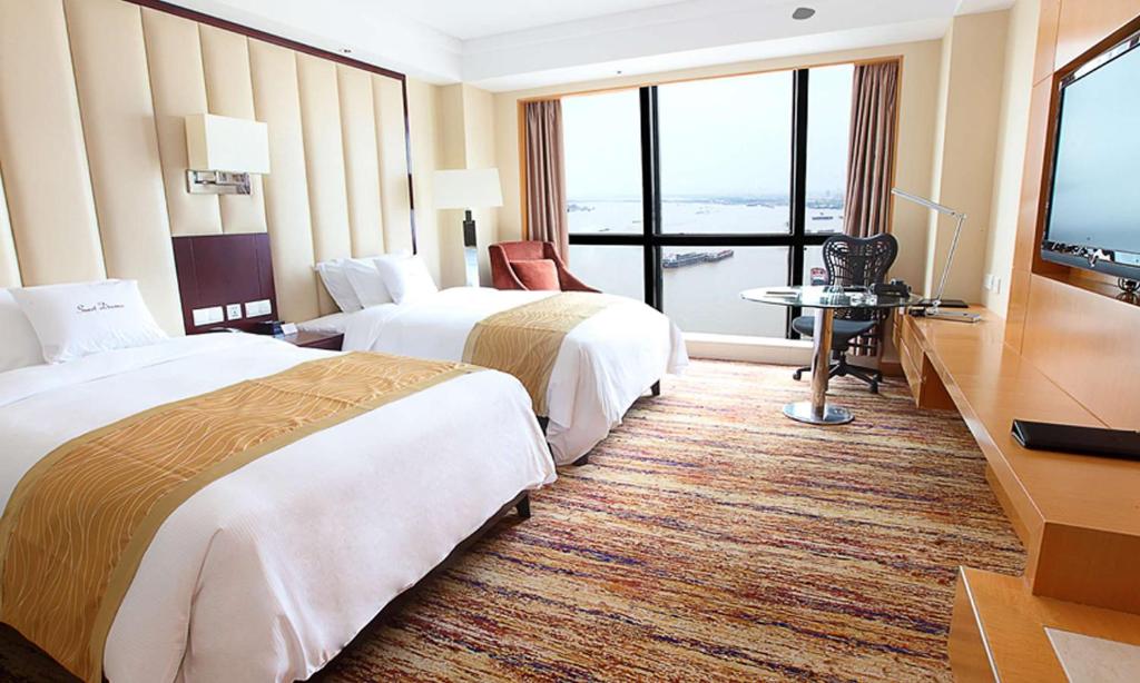 Postel nebo postele na pokoji v ubytování DoubleTree by Hilton Wuhu