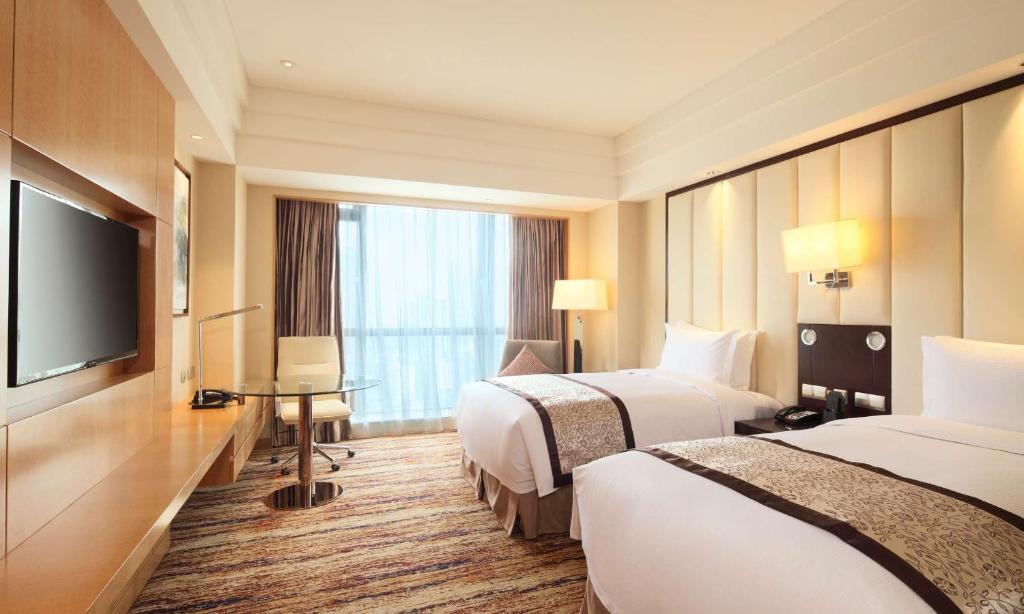 Postel nebo postele na pokoji v ubytování DoubleTree by Hilton Wuhu