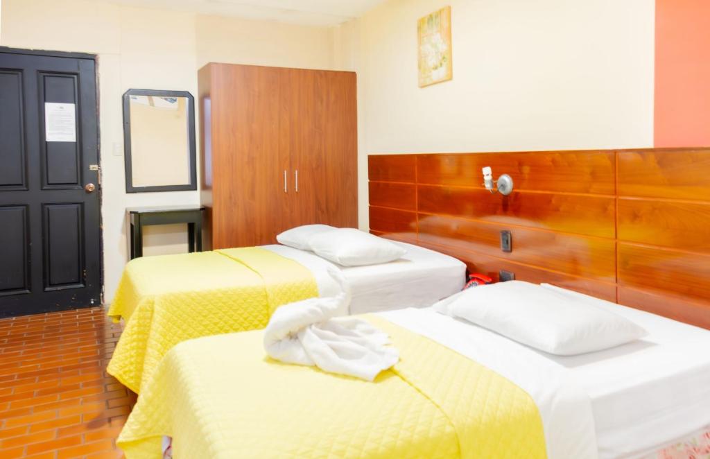 Postel nebo postele na pokoji v ubytování Hostal Antares