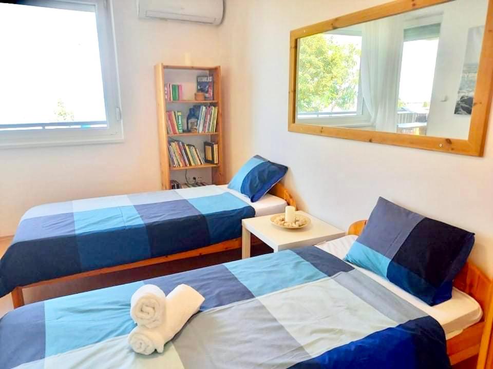 Posteľ alebo postele v izbe v ubytovaní Balaton BeachSide Apartman Siófok N1