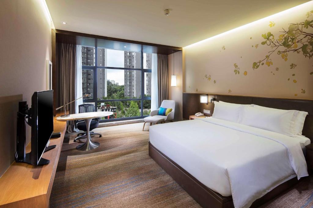 TV a/nebo společenská místnost v ubytování Hilton Garden Inn Shiyan