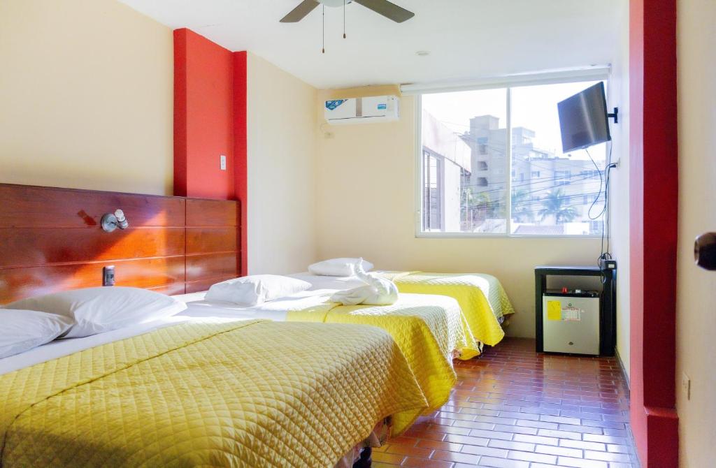 Postel nebo postele na pokoji v ubytování Hostal Antares