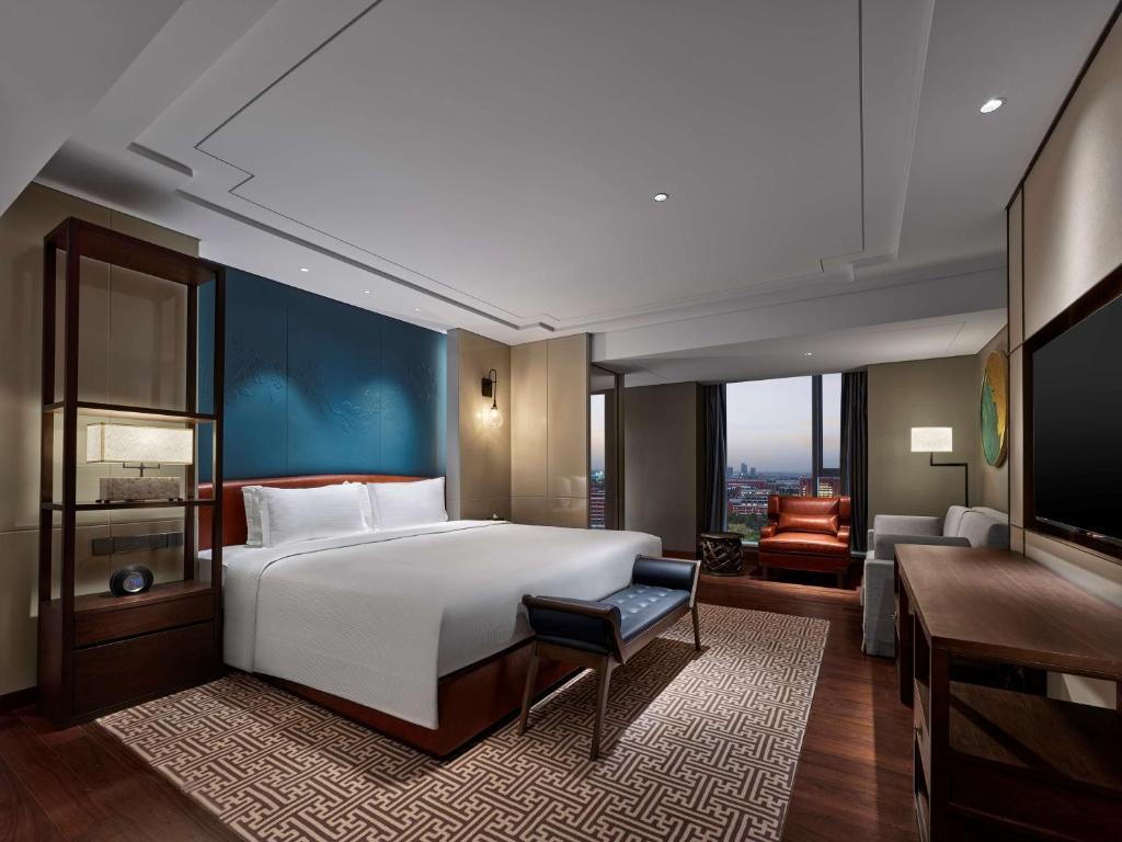 Postel nebo postele na pokoji v ubytování Doubletree By Hilton Baoding