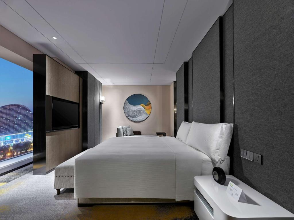 Postel nebo postele na pokoji v ubytování Doubletree By Hilton Baoding