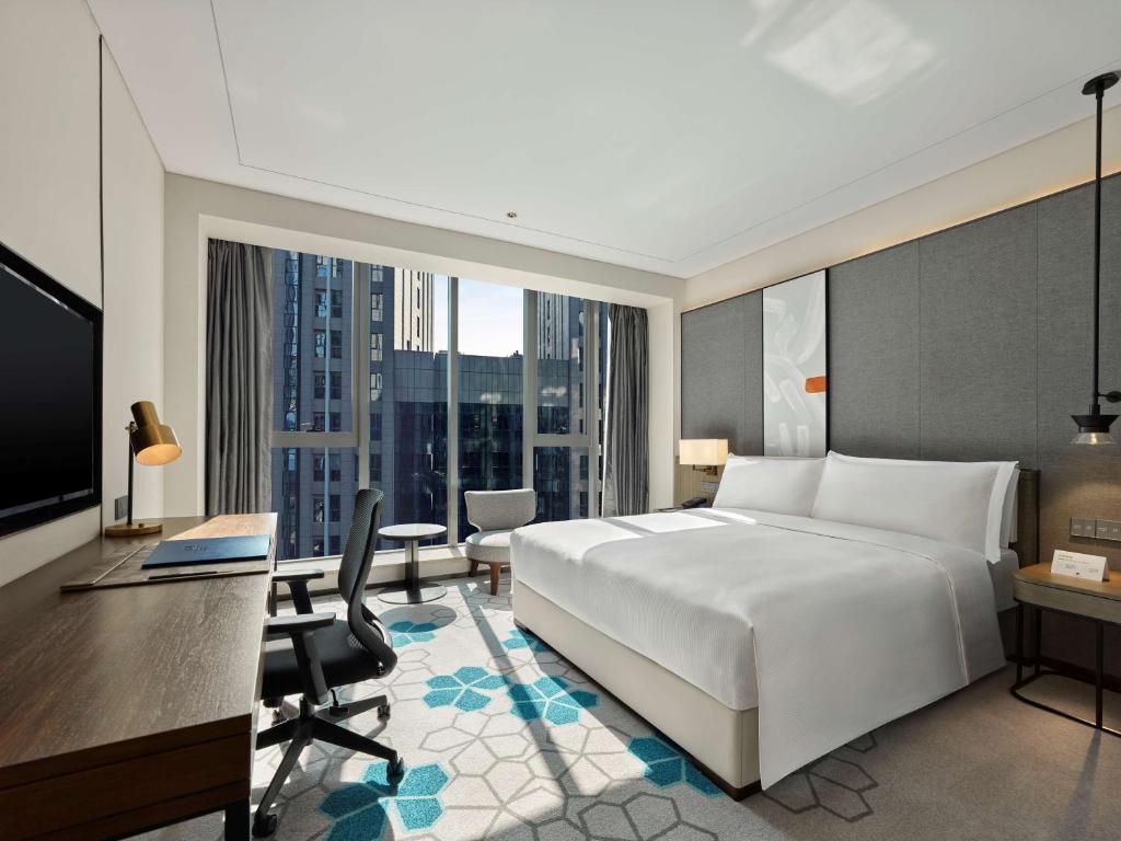 Postel nebo postele na pokoji v ubytování Doubletree By Hilton Baoding