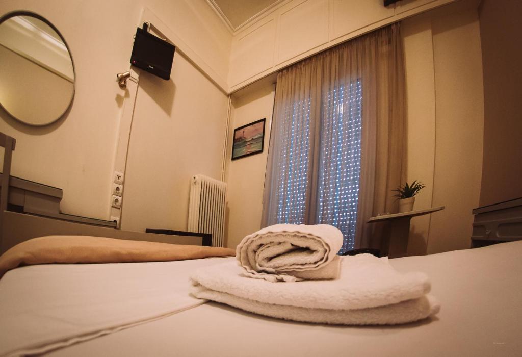 Postel nebo postele na pokoji v ubytování Hotel King Pyrros
