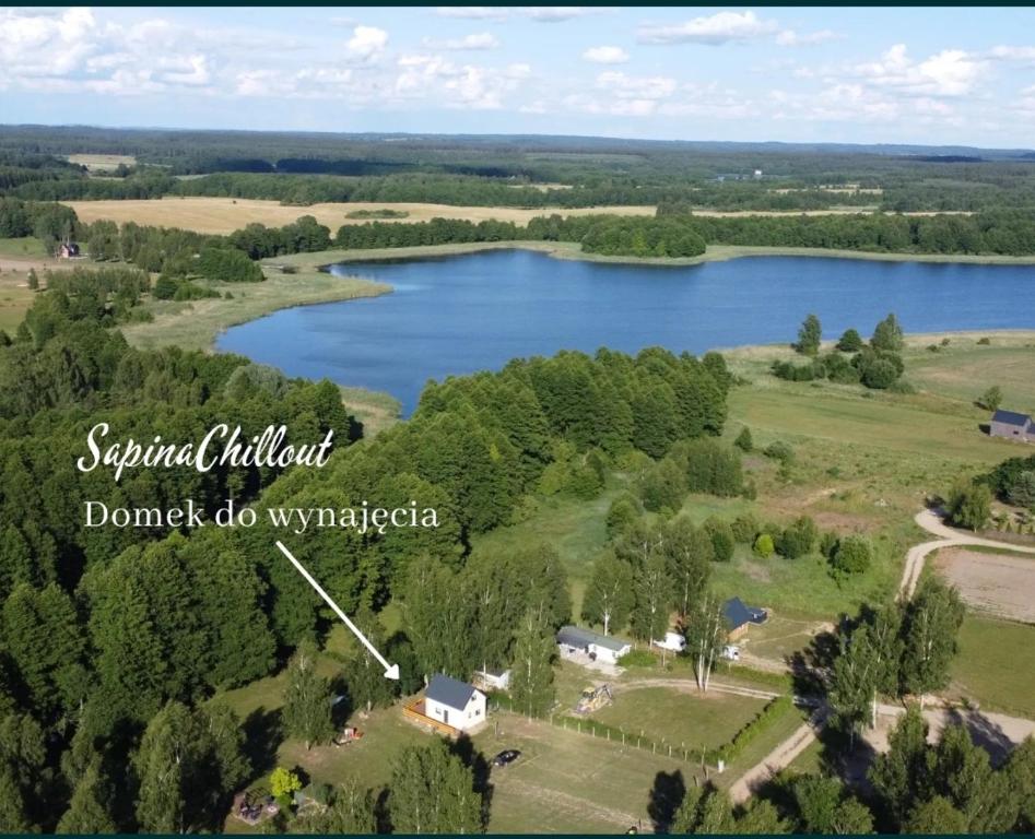 an aerial view of a lake with a house at SapinaChillout in Pozezdrze