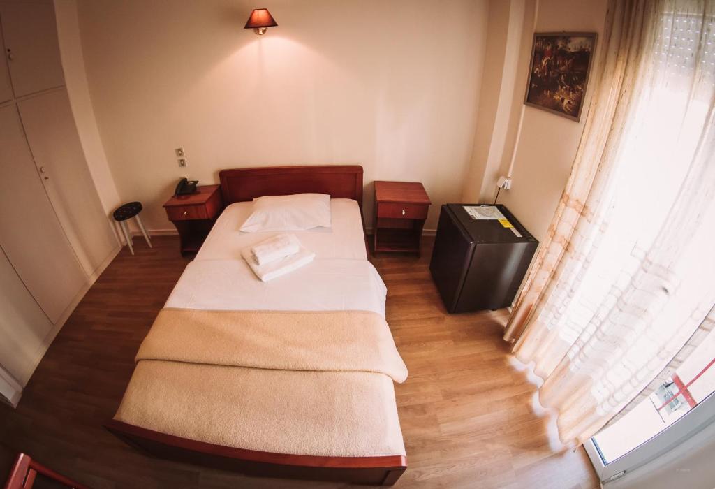 Postel nebo postele na pokoji v ubytování Hotel King Pyrros