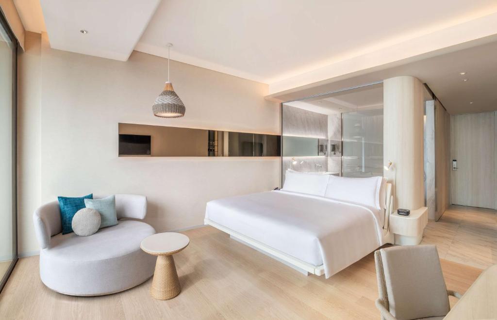 Postel nebo postele na pokoji v ubytování Hilton Pattaya