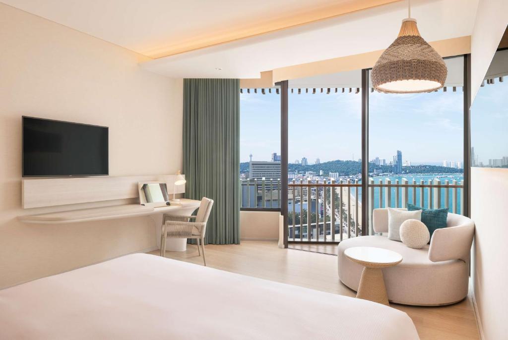 Postel nebo postele na pokoji v ubytování Hilton Pattaya