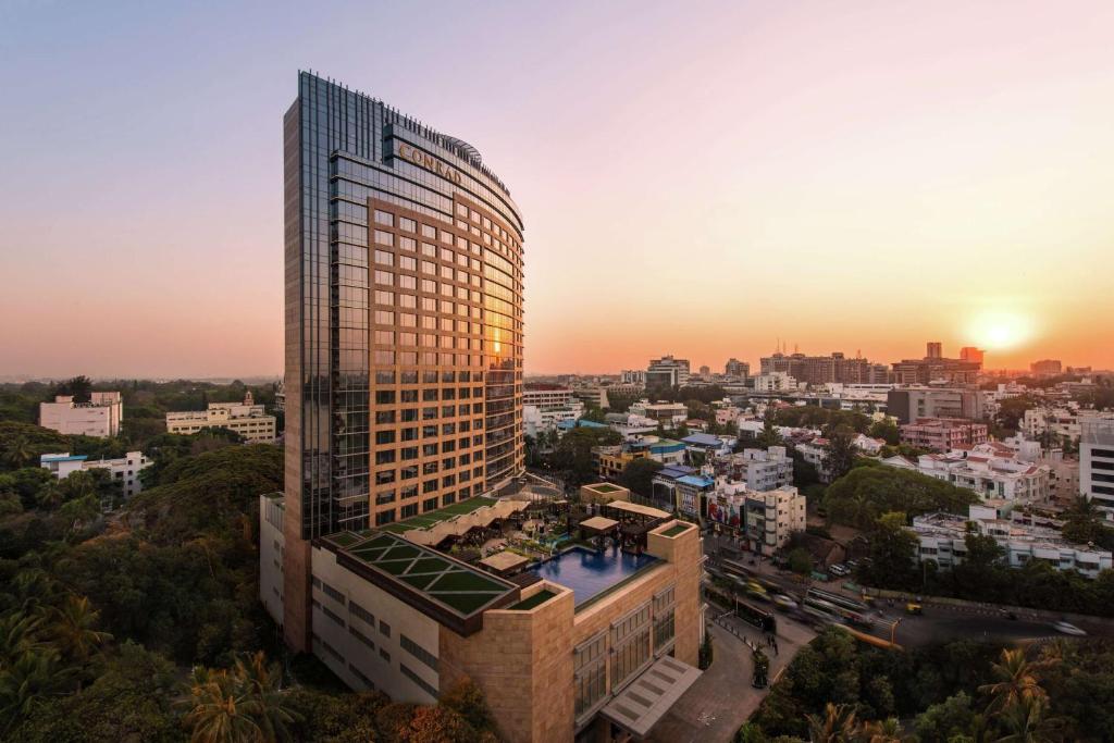 a rendering of a tall building in a city at Conrad Bengaluru in Bangalore