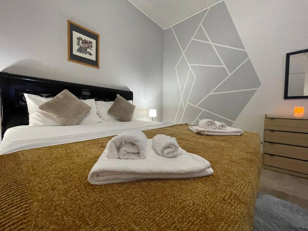 Voodi või voodid majutusasutuse Arena Maroncelli Room2 toas