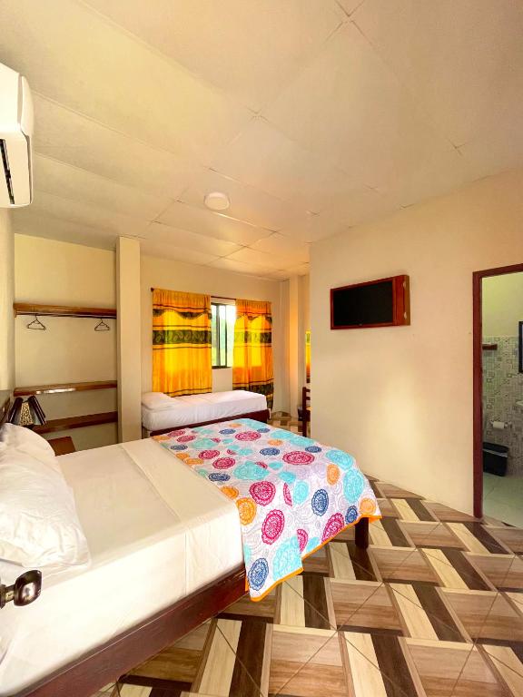 Postel nebo postele na pokoji v ubytování Hostal Laurita Beach