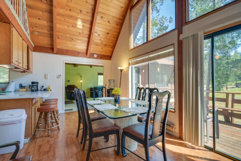 a kitchen and dining room with a table and chairs at Quiet 1 BR and Loft Home about 6 Mi to Yosemite in Groveland