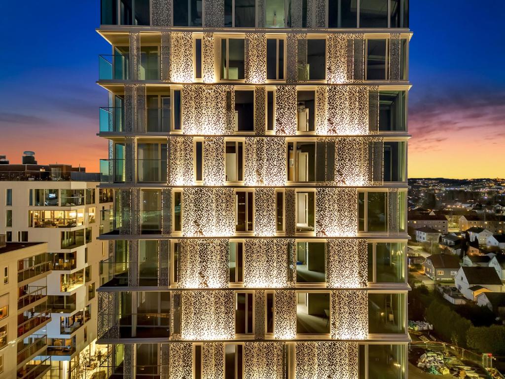 a rendering of a building with lights on it at LUX Hotel in Lillestrøm