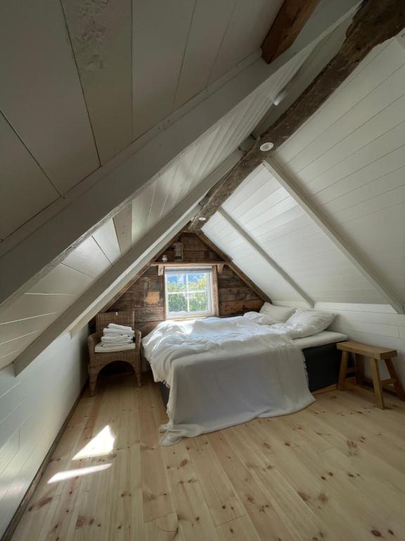 a bedroom with a bed in a attic at Pittelille - supercozy small luxury in Henningsvær in Henningsvær