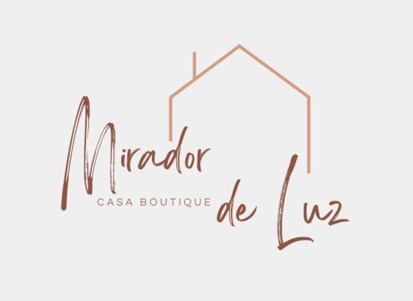 a logo for an online boutique be us at Suits Mirador de Luz in Cuenca