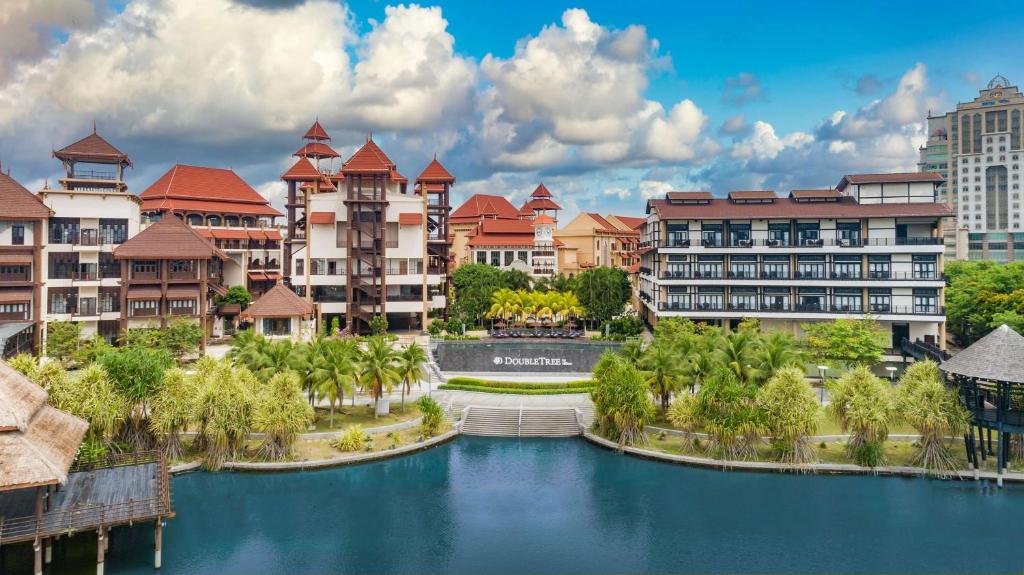 a rendering of a resort with a river and buildings at DoubleTree by Hilton Putrajaya Lakeside in Putrajaya