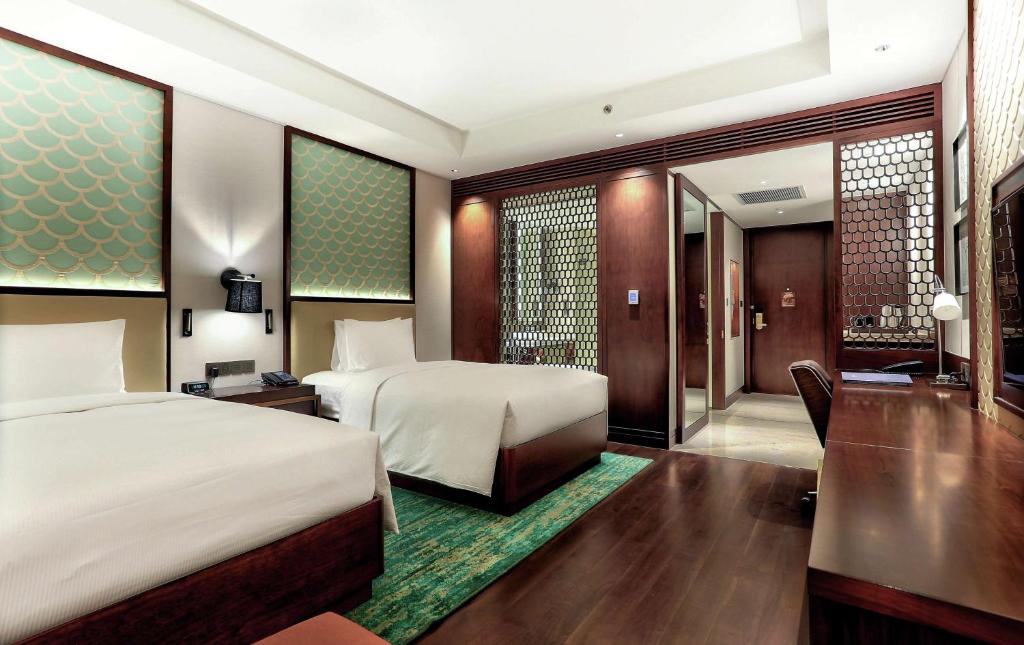 Postel nebo postele na pokoji v ubytování Hilton Da Nang