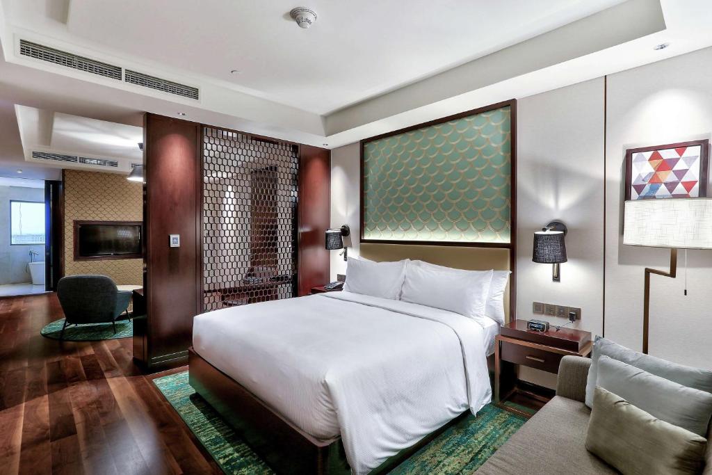 Postel nebo postele na pokoji v ubytování Hilton Da Nang
