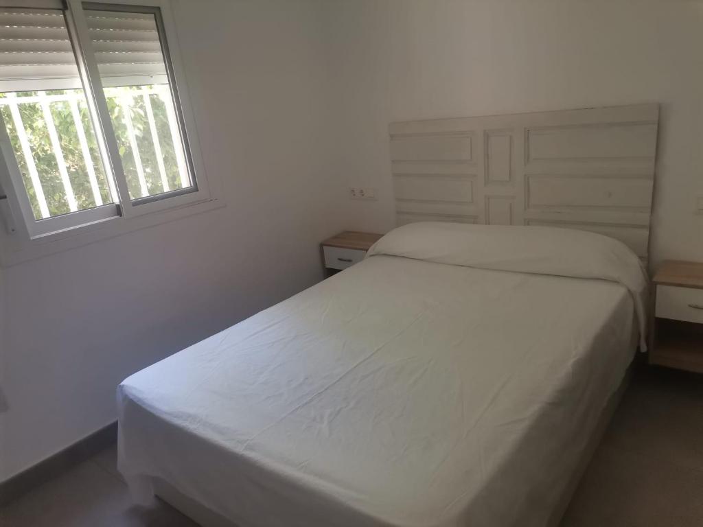 Postel nebo postele na pokoji v ubytování El Rinconcito Cubano en la playa