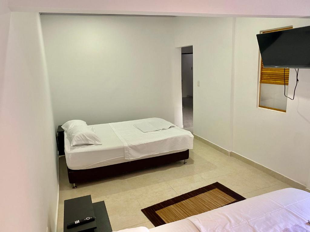 Postel nebo postele na pokoji v ubytování ApartaEstudios Viva, en la vega