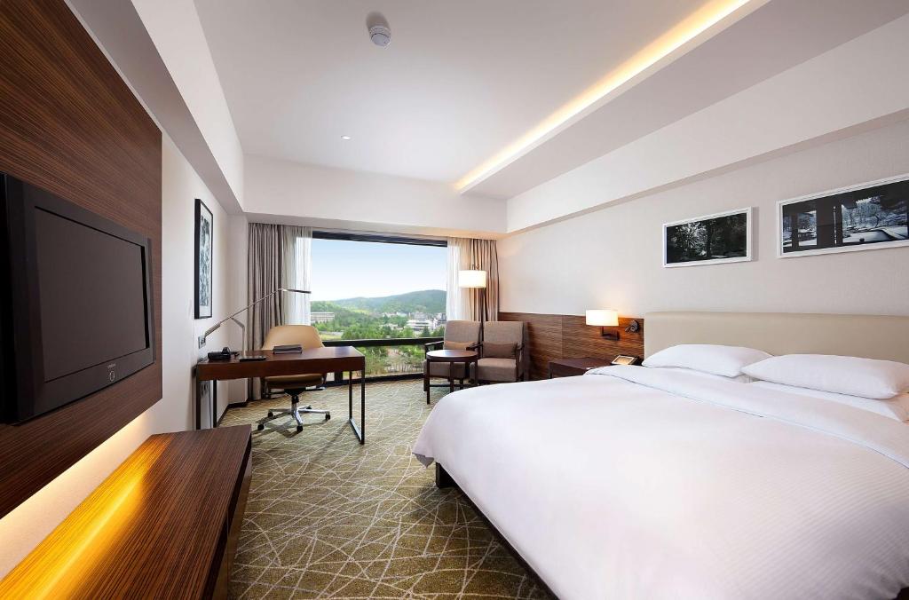 Postel nebo postele na pokoji v ubytování Hilton Gyeongju