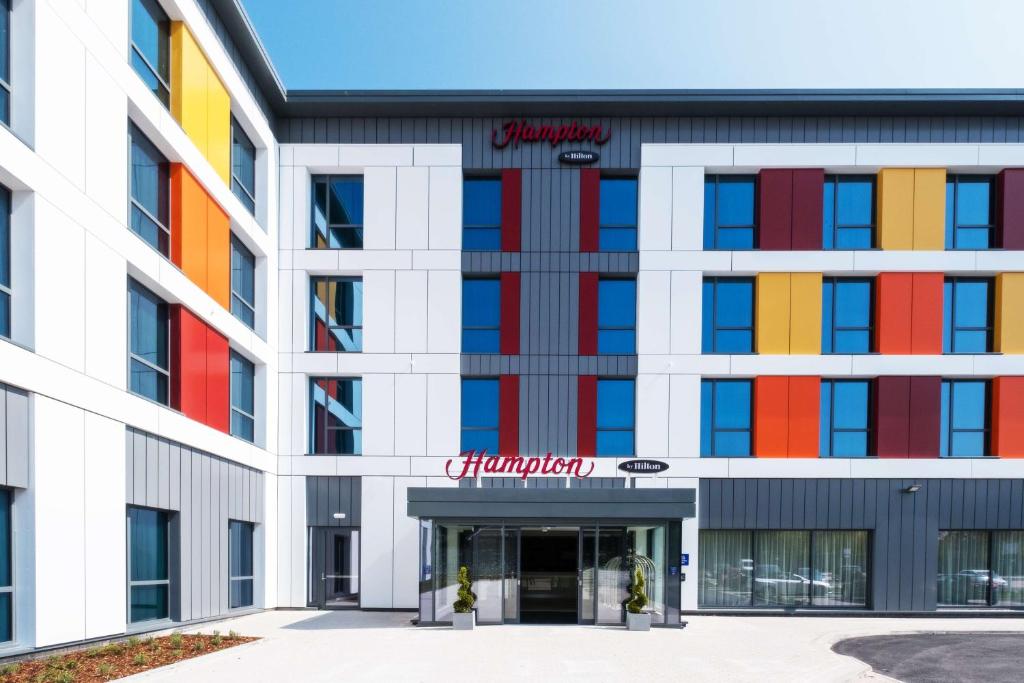 an office building with colorful windows at Hampton By Hilton Aberdeen Westhill in Westhill 