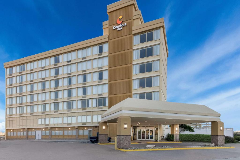 an image of a hotel with a building at Comfort Inn South Oceanfront in Nags Head