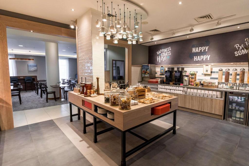 a store with a happy birthday sign on the wall at Hampton by Hilton Bournemouth in Bournemouth