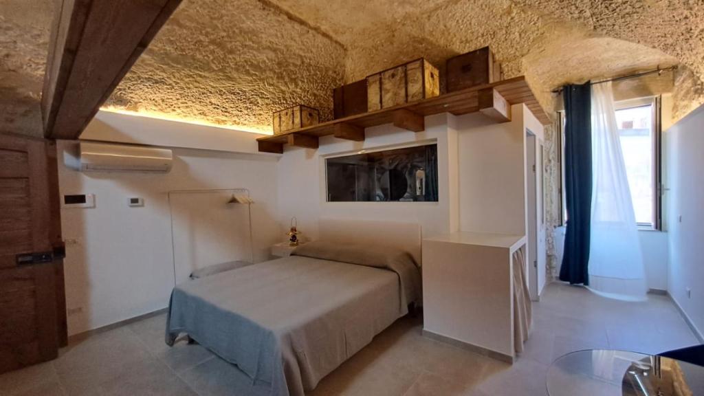 Llit o llits en una habitació de CAIETA Housing