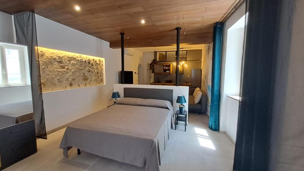 Llit o llits en una habitació de CAIETA Housing
