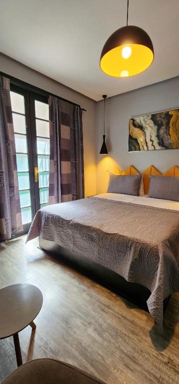Postel nebo postele na pokoji v ubytování Hotel Voila la Moneda