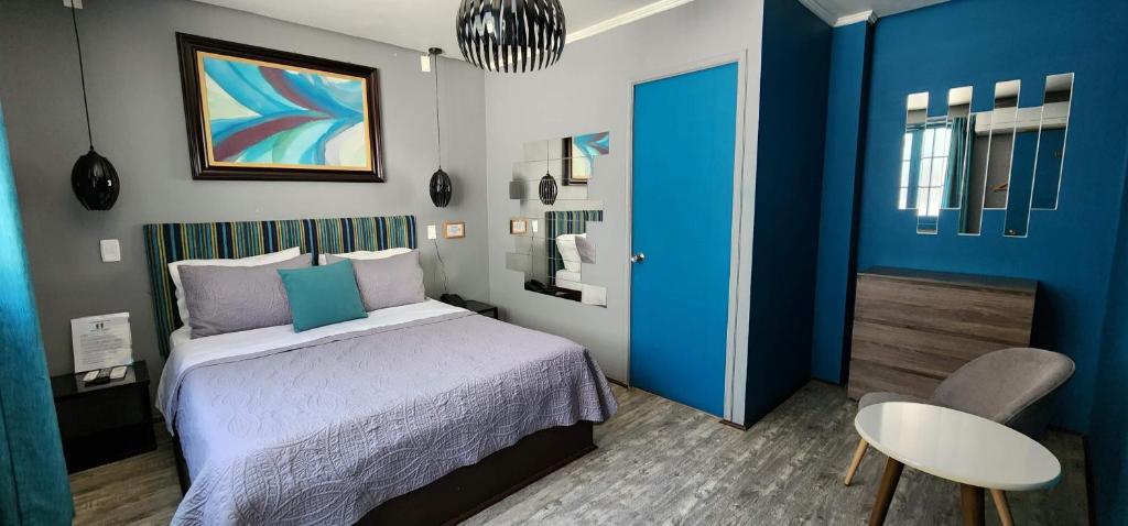 Postel nebo postele na pokoji v ubytování Hotel Voila la Moneda