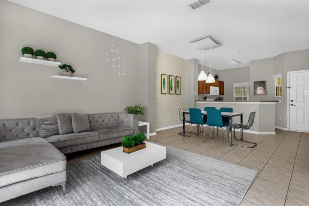 a living room with a couch and a table at 3 Bedrooms 25 Bathrooms Encantada 3122 Yl in Orlando