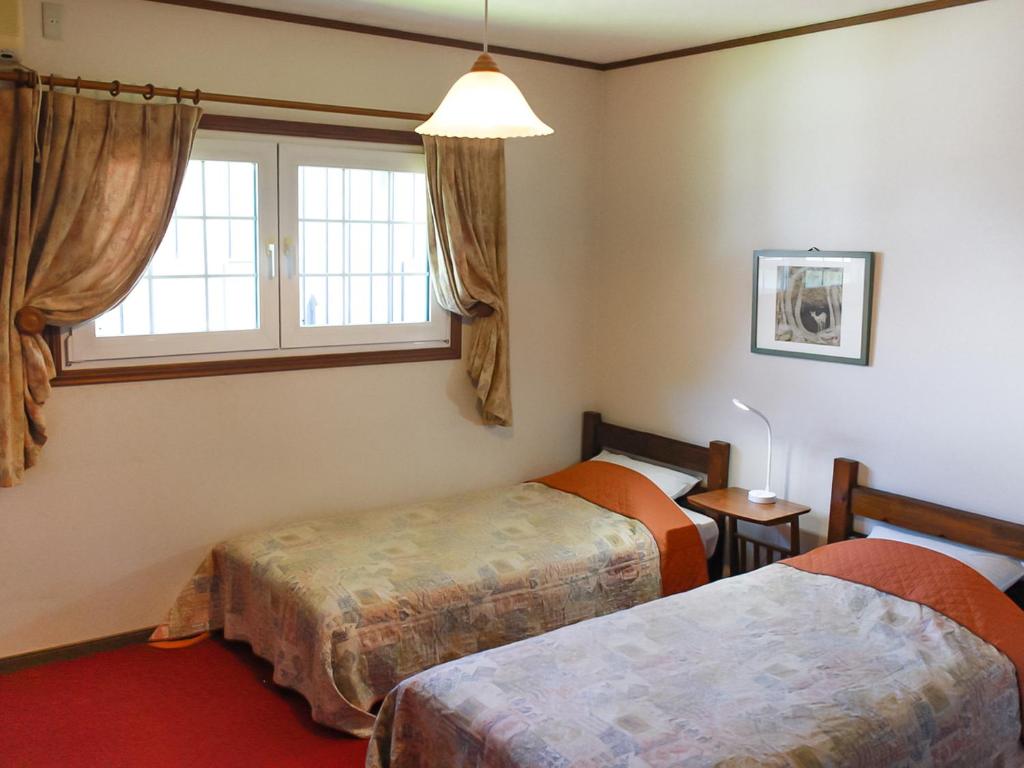 Postel nebo postele na pokoji v ubytování Landhaus Dancru Netz