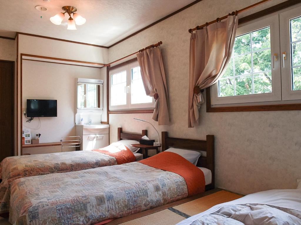 Postel nebo postele na pokoji v ubytování Landhaus Dancru Netz