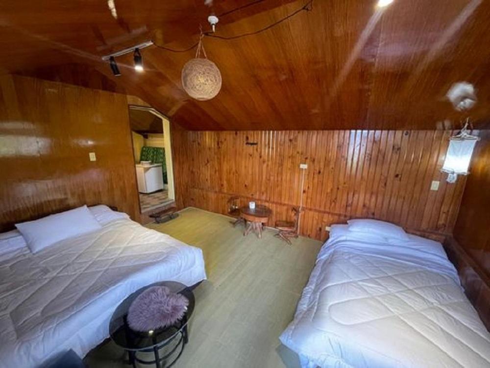 מיטה או מיטות בחדר ב-Spacious Tagaytay Retreat for 12pax