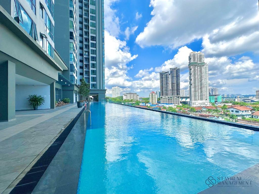 a swimming pool in the middle of a city at SKS Pavillion Residences by Stayrene in Johor Bahru
