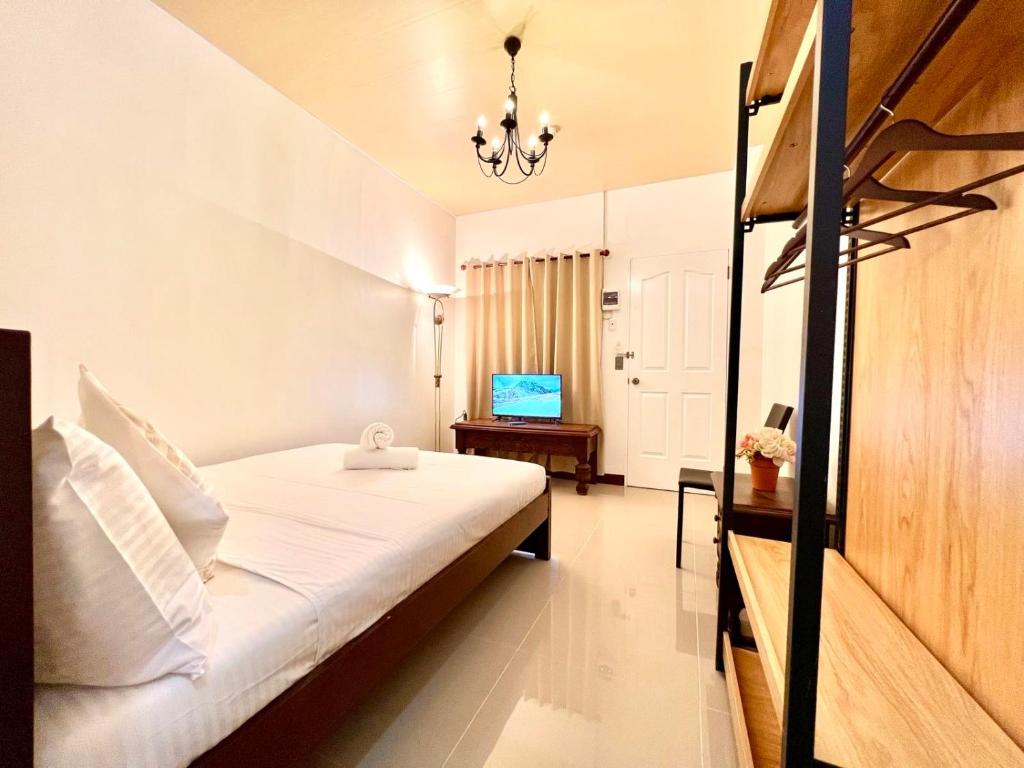 Postel nebo postele na pokoji v ubytování E&R Airport Hotel