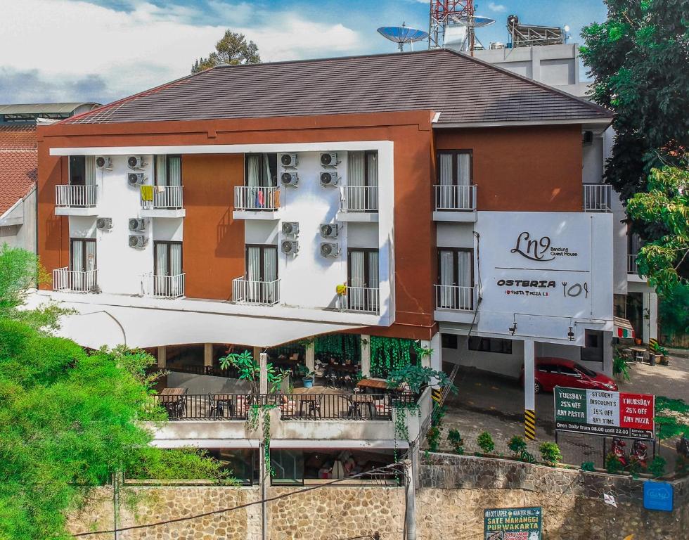 a large building with a sign in front of it at LN9 Bandung Guest House in Bandung