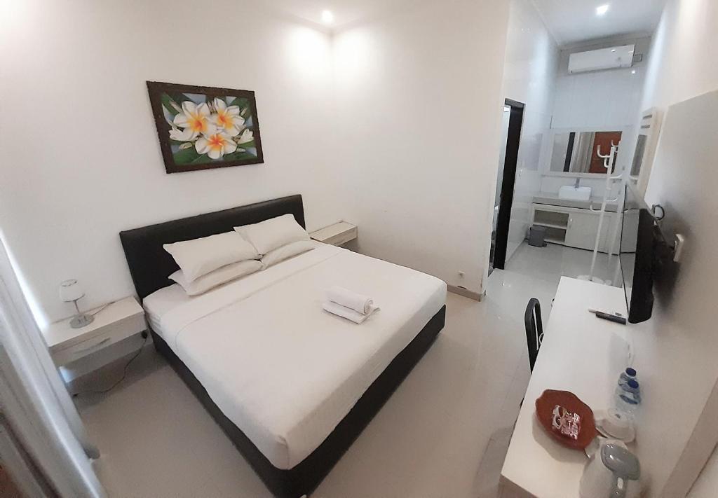 Postel nebo postele na pokoji v ubytování De Loran Hotel