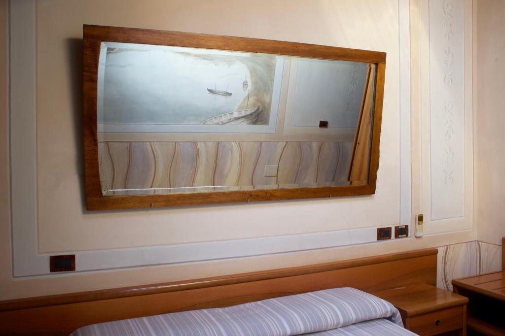 Postel nebo postele na pokoji v ubytování Albergo Giulia Gonzaga