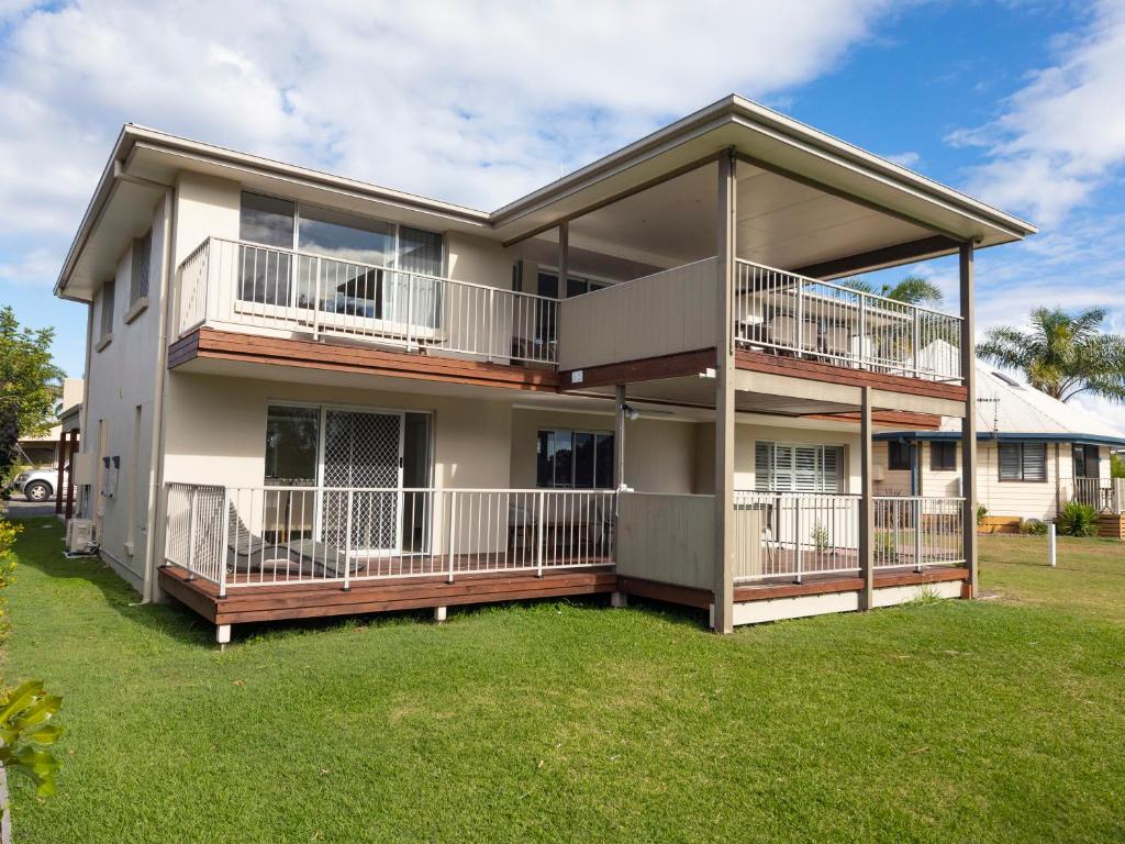a large house with balconies and a yard at NRMA Forster Tuncurry in Tuncurry